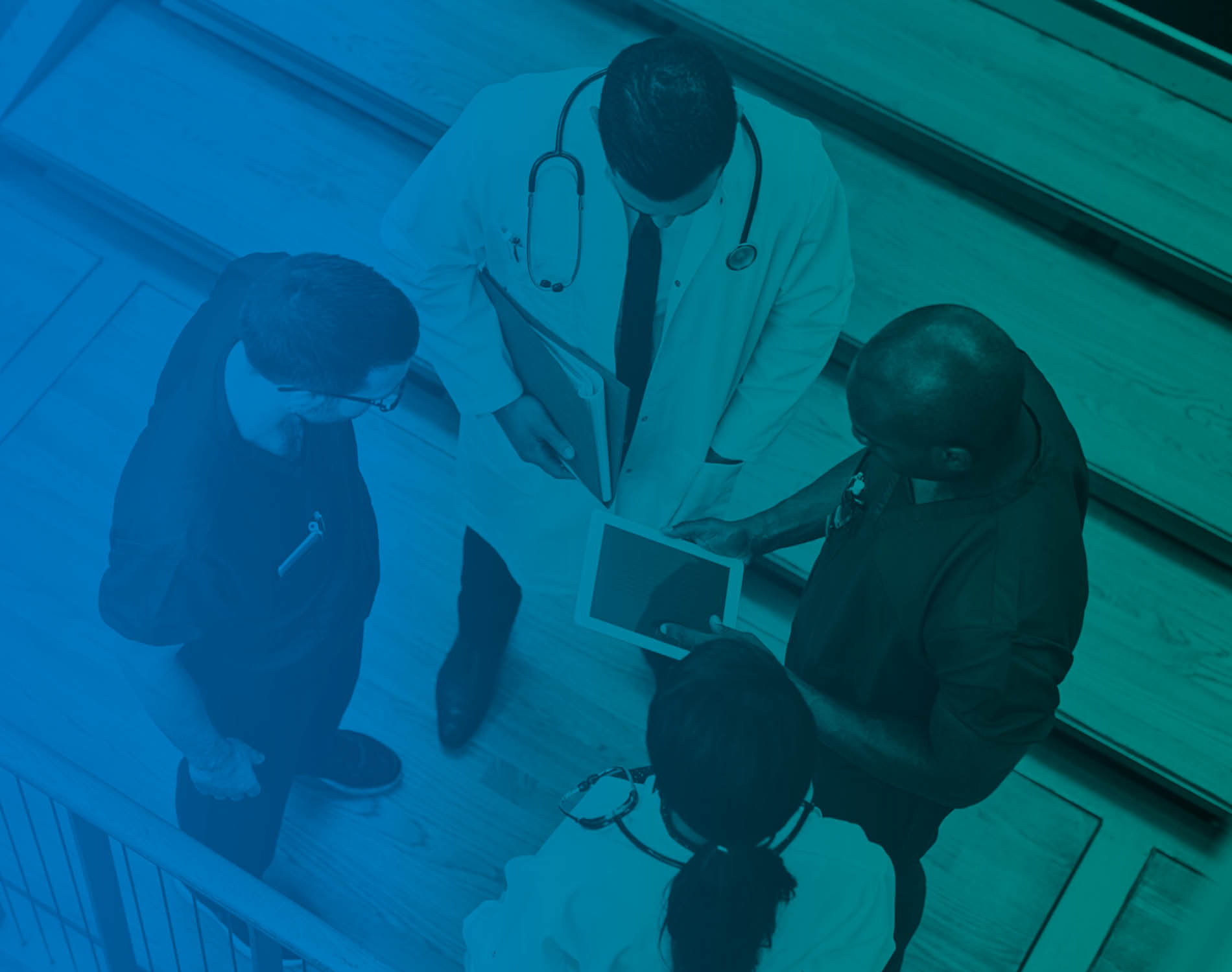 Medical professionals gathered in a circle, chatting. 