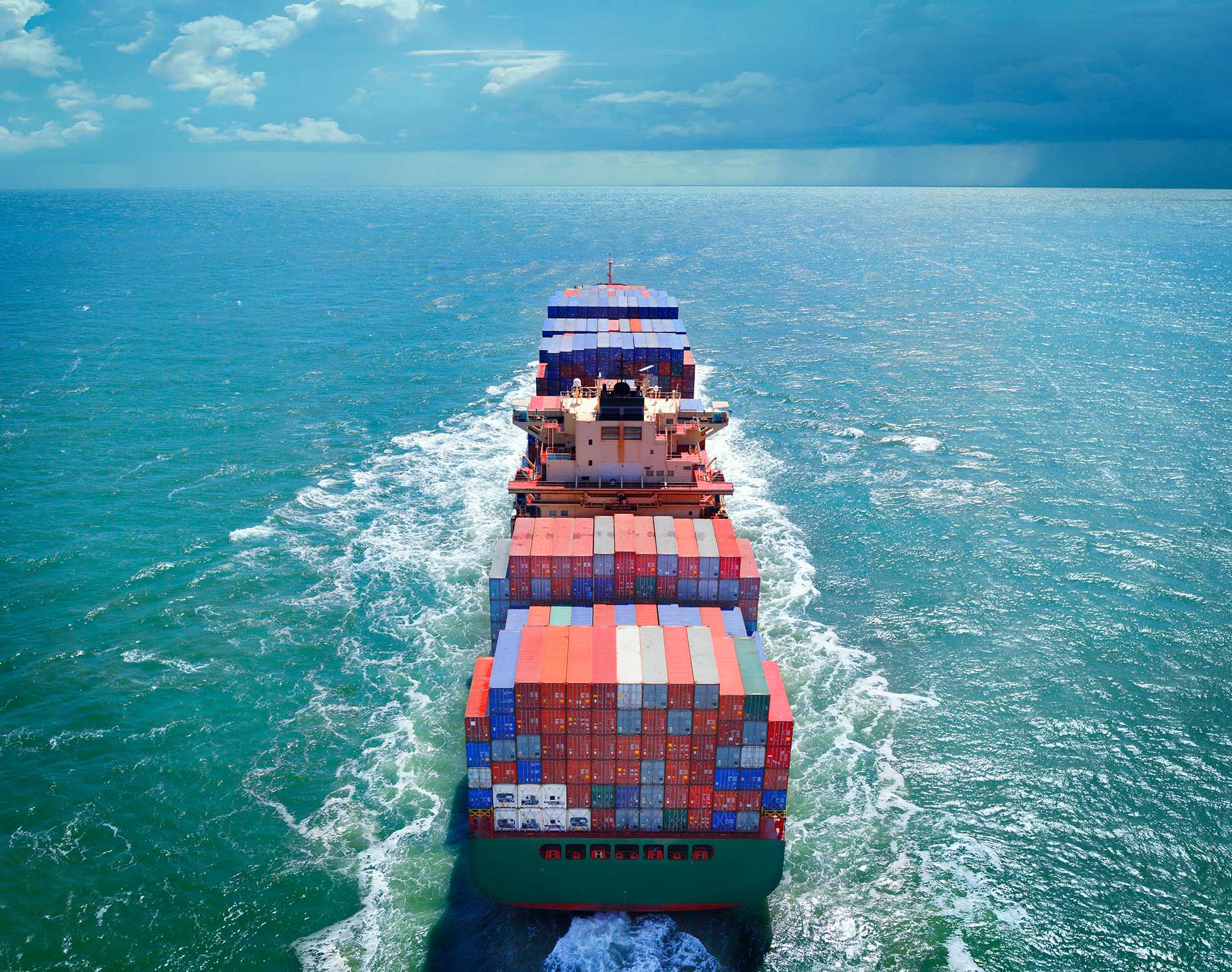 Aerial view of freight ship with cargo containers