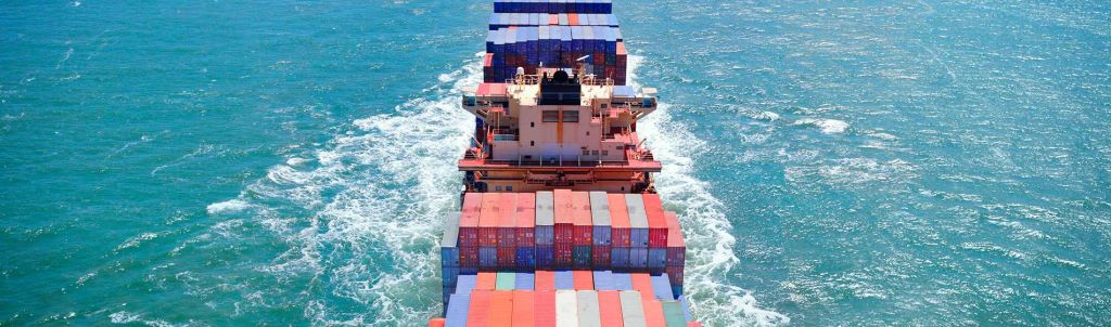 Aerial view of freight ship with cargo containers